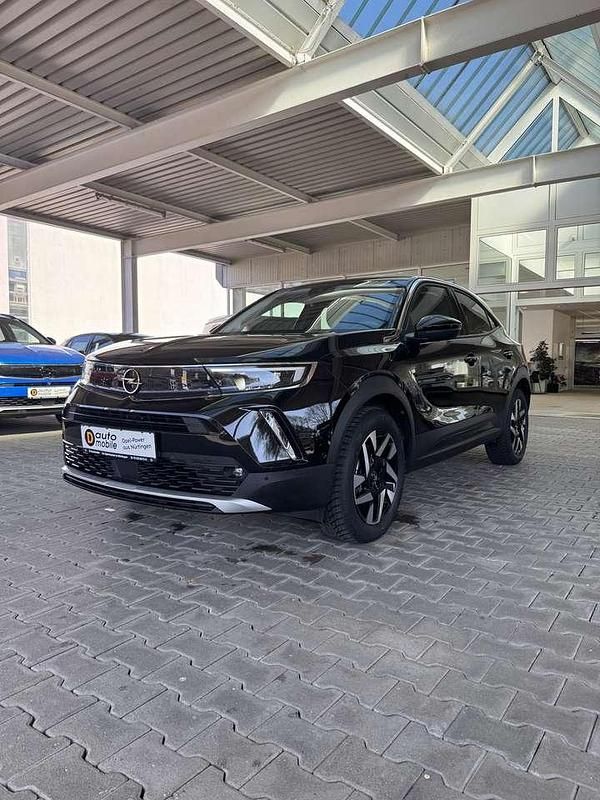 Gebraucht Opel Mokka-e Elegance 100 kW (136 PS) 2022 Diamant schwarz/karbon schwarz SUV
