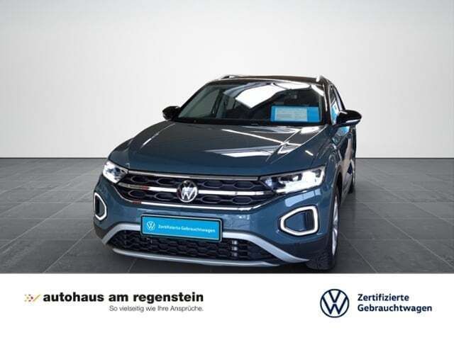 Petroleum blau metallic Gebraucht 2024 VW T-Roc Style SUV | 30.940 € (Fairer Preis) - Bild 1/4