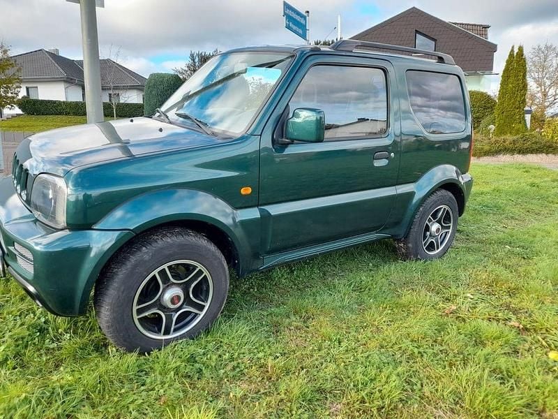 Grün Gebraucht 2006 Suzuki Jimny Style SUV | 9.600 € (Fairer Preis) - Bild 1/4