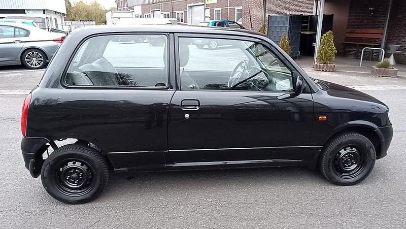 Gebraucht Daihatsu Cuore 56 PS (41 kW) 1999 Schwarz Kleinwagen