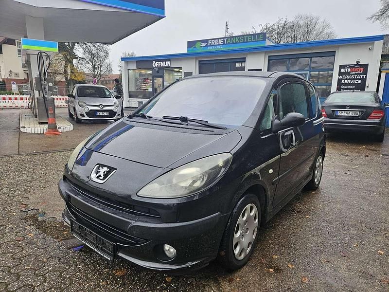 Farbe schwarz Gebraucht 2007 Peugeot 1007 Premium Kleinwagen | 1.999 € (Fairer Preis) - Bild 1/4
