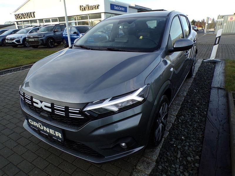 Grau Neu 2025 Dacia Sandero Expression Limousine | 16.500 € - Bild 1/4