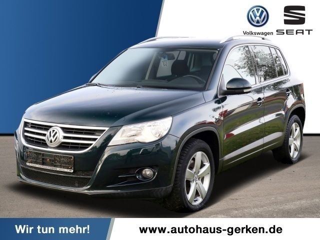 Grün metallic Gebraucht 2009 VW Tiguan Sportline SUV | 11.990 € - Bild 1/4