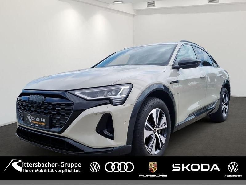 Beige Gebraucht 2023 Audi Q8 Sportback e-tron Advanced SUV | 62.880 € (Fairer Preis) - Bild 1/4