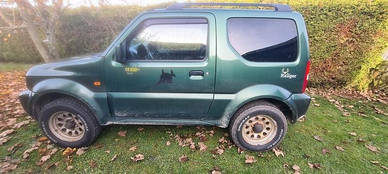 Grün Gebraucht 2009 Suzuki Jimny SUV | 8.800 € (Fairer Preis) - Bild 1/4