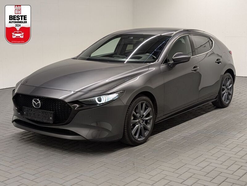 Grau (machinegraumet.) Gebraucht 2020 Mazda 3 Selection Limousine | 21.480 € (Fairer Preis) - Bild 1/4