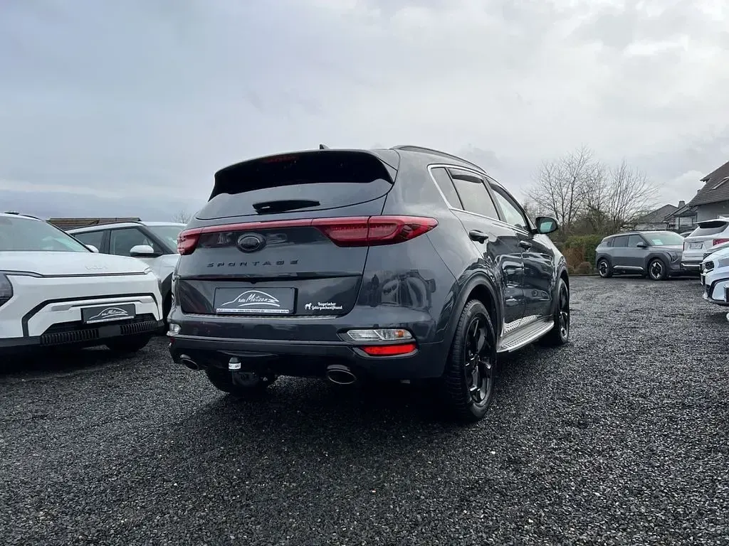 Gebraucht Kia Sportage 177 PS (130 kW) 2021 H8g) pentametal met. (grau SUV