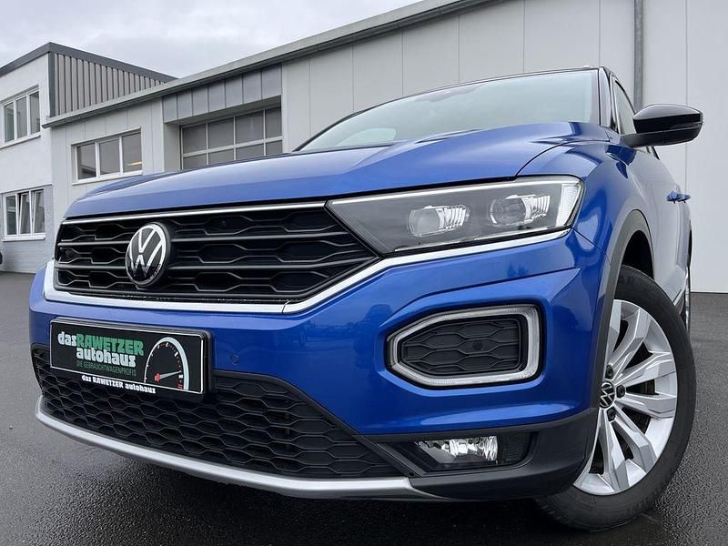 Ravennablau Gebraucht 2021 VW T-Roc Active SUV | 22.860 € (Guter Preis) - Bild 1/4