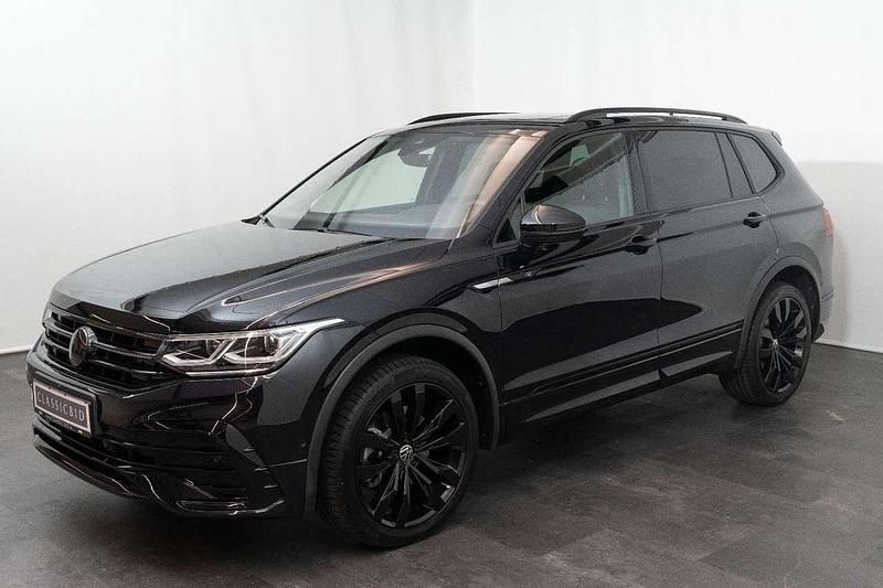 Deep black perleffekt Gebraucht 2024 VW Tiguan Allspace R-line SUV | 51.900 € - Bild 1/4