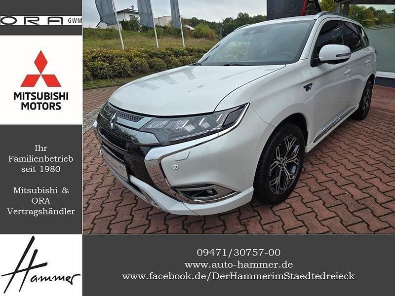 Weiß Gebraucht 2019 Mitsubishi Outlander P-HEV Top SUV | 20.900 € (Fairer Preis) - Bild 1/4