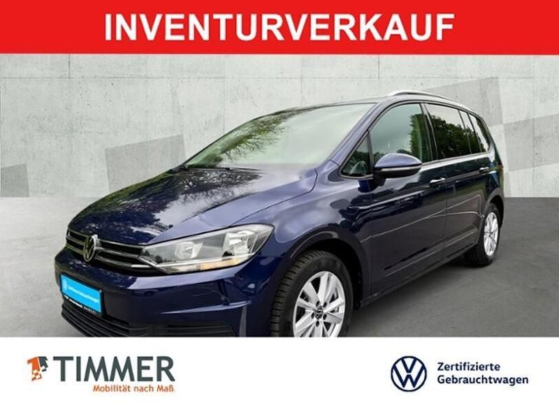 Blau Gebraucht 2024 VW Touran Comfortline Van / Kleinbus | 32.840 € (Fairer Preis) - Bild 1/4