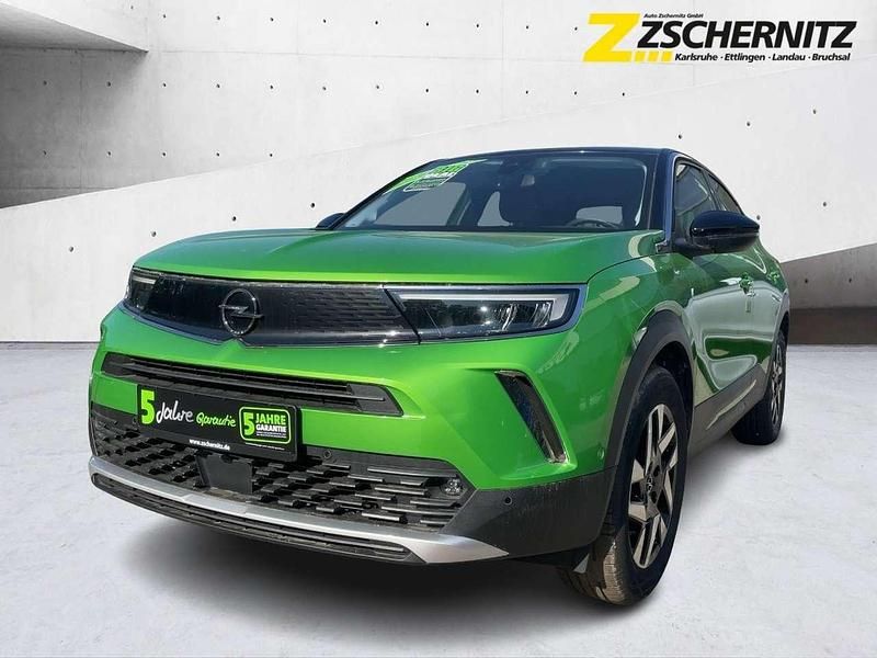 Matcha green/ikone gruen Gebraucht 2021 Opel Mokka Elegance SUV | 14.390 € (Fairer Preis) - Bild 1/4