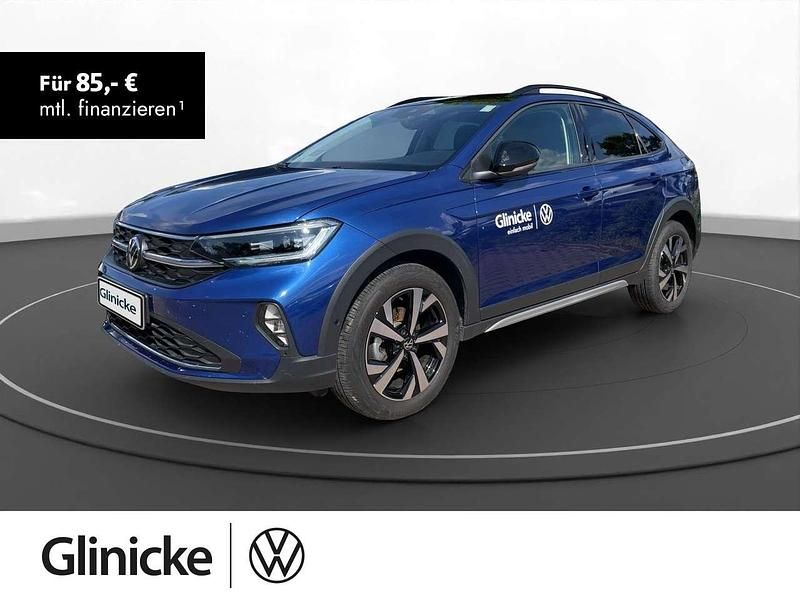 Reef blue metallic / schwarz Gebraucht 2024 VW Taigo Style SUV | 23.790 € (Guter Preis) - Bild 1/3