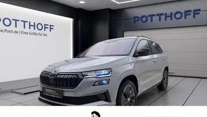 Grau Gebraucht 2024 Skoda Karoq SportLine SUV | 33.443 € (Superpreis)