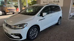 Pure white Gebraucht 2024 VW Touran R-line Van / Kleinbus | 38.685 € (Fairer Preis)