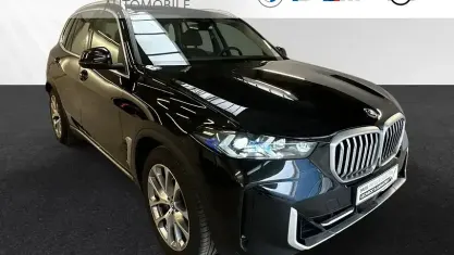 Gebraucht BMW X5 Sport Line 489 PS (359 kW) 2024 Black sapphire metallic SUV