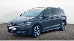 Grau Gebraucht 2024 VW Touran Highline Van / Kleinbus | 36.445 € (Fairer Preis)
