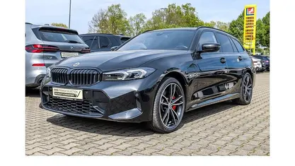 Second-hand BMW 330e M Sport 292 CP (214 kW) 2022 Negru Break