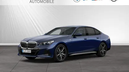 Gebraucht BMW 550e M Sport 489 PS (359 kW) 2024 Bmw individual tansanitblau metallic Limousine