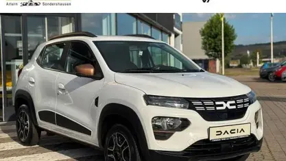 Gebraucht Dacia Spring Extreme 47 kW (65 PS) 2023 Kaolinweiß Kleinwagen