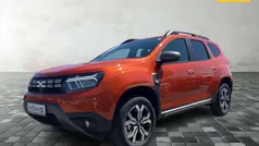 Arizonaorange metallic Gebraucht 2024 Dacia Duster Journey SUV | 23.399 € (Guter Preis)