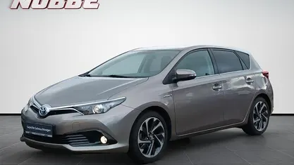 Gebraucht Toyota Auris Hybrid Design 136 PS (100 kW) 2015 Avantgarde bronze metallic Limousine