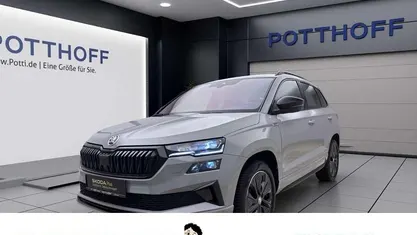 Grau Gebraucht 2024 Skoda Karoq SportLine SUV | 32.997 € (Superpreis)