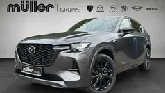 Machine gray Gebraucht 2025 Mazda CX-60 Homura-Line SUV | 52.407 € (Fairer Preis)