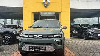 Gebraucht Dacia Spring Extreme 47 kW (65 PS) 2024 Olivgrün Kleinwagen