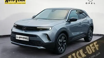 Gebraucht Opel Mokka-e Elegance 100 kW (136 PS) 2023 Kontrast grau metallic SUV
