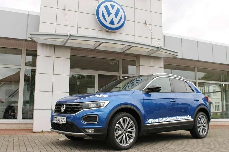 Ravennablau metallic Gebraucht 2021 VW T-Roc Active SUV | 25.880 € (Etwas zu teuer) - Bild 1/4