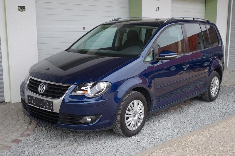Blau Gebraucht 2010 VW Touran Freestyle Van / Kleinbus | 3.899 € - Bild 1/4
