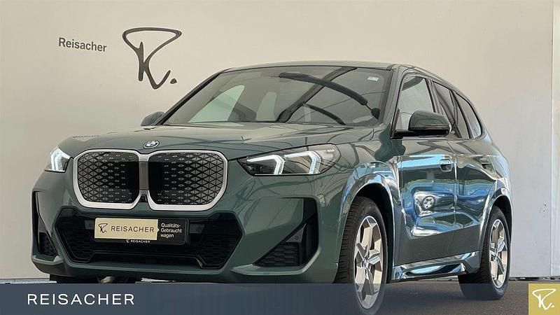 Cape york grün metallic Gebraucht 2023 BMW iX1 Luxury Line SUV | 44.349 € (Fairer Preis) - Bild 1/4