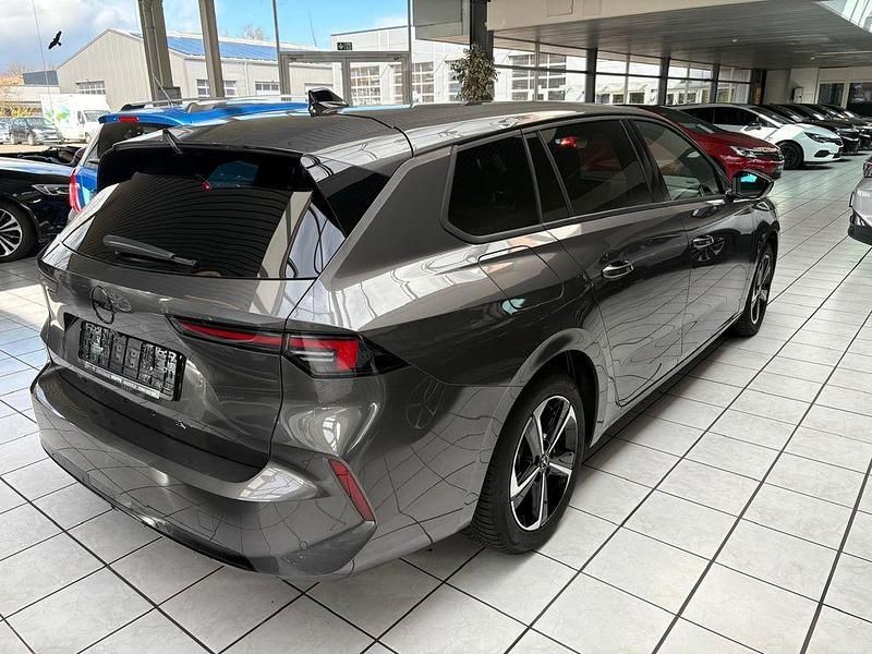 Gebraucht Opel Astra 131 PS (96 kW) 2024 Mondsteingrau metallic (metallic) Kombi