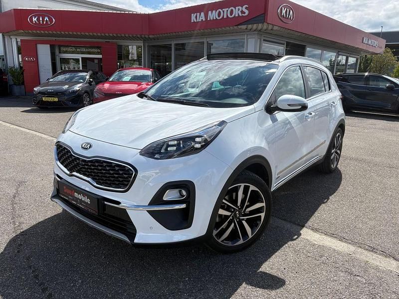 (hw2) deluxe white (metallic) Gebraucht 2021 Kia Sportage Platinum SUV | 26.450 € (Fairer Preis) - Bild 1/4
