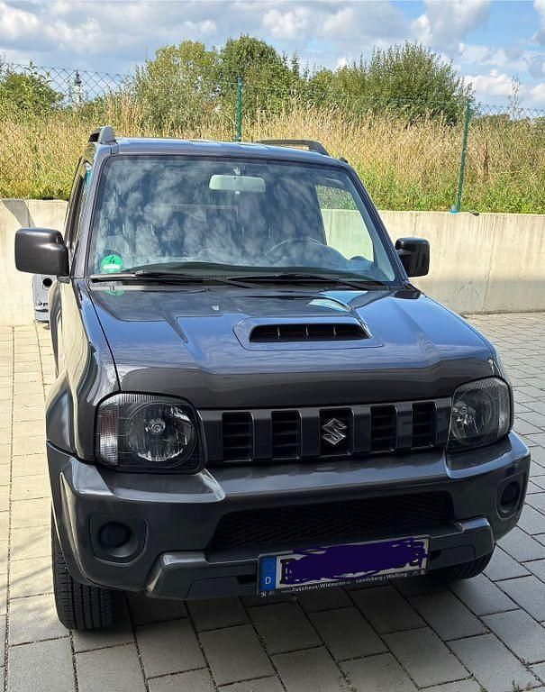 Grau Gebraucht 2014 Suzuki Jimny Comfort SUV | 14.350 € (Fairer Preis) - Bild 1/4