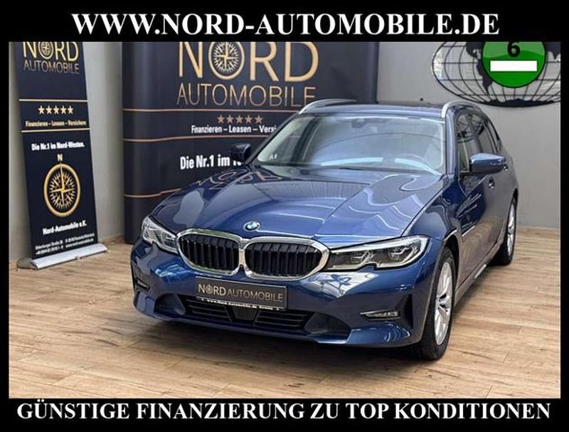 Phytonicblau metallic (metallic) Gebraucht 2021 BMW 320e Sport Line Kombi | 29.350 € (Etwas zu teuer) - Bild 1/3