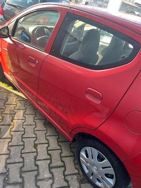 Gebraucht Nissan Pixo 68 PS (50 kW) 2009 Rot Kleinwagen