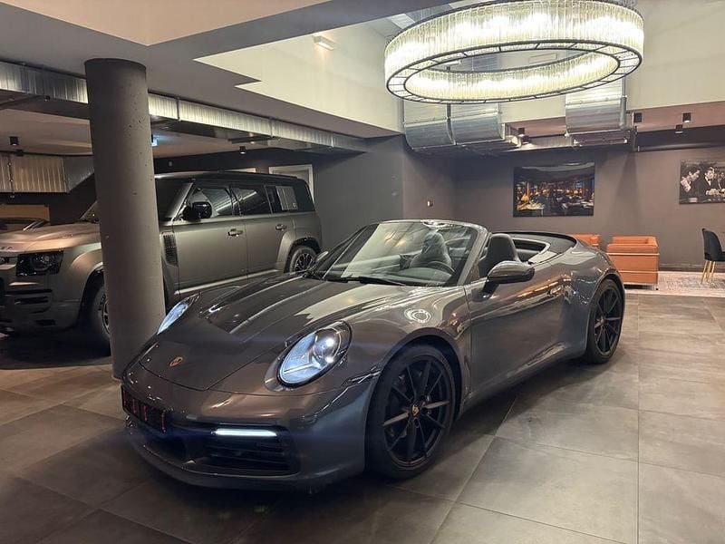 Grau Gebraucht 2023 Porsche 911 Carrera Cabriolet Cabrio | 117.777 € (Superpreis) - Bild 1/4