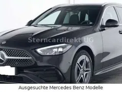 Obsidianschwarzmetallic Gebraucht 2024 Mercedes C300e AMG Kombi | 48.890 € (Fairer Preis)
