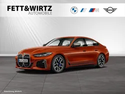 Sunset orange metallic Gebraucht 2024 BMW i4 Performance Limousine | 49.990 € (Superpreis)