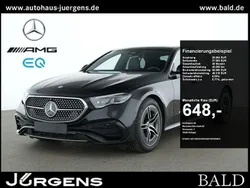 Schwarz obsidianschwarz metallic Gebraucht 2024 Mercedes E450 AMG Limousine | 68.490 € (Superpreis)