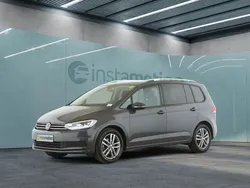 Grau Gebraucht 2024 VW Touran Comfortline Van / Kleinbus | 38.575 € (Teuer)