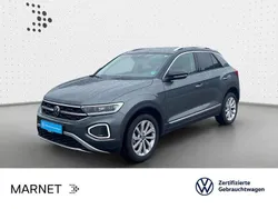 Indiumgrau metallic/schwarz Gebraucht 2024 VW T-Roc Style SUV | 28.190 € (Fairer Preis)