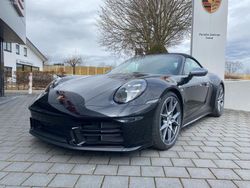 Tiefschwarzmetallic Gebraucht 2024 Porsche 911 Carrera T Cabrio | 179.292 €