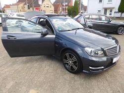 755 tenoritgrau Gebraucht 2015 Mercedes C180 AMG Coupé | 17.999 € (Guter Preis)