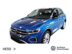Ravennablau metallic/schwarz Gebraucht 2024 VW T-Roc Style SUV | 28.699 € (Fairer Preis)