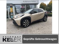 Ginger beige metallic/ night sky black Gebraucht 2024 Toyota Aygo X Basis SUV | 15.960 € (Fairer Preis)