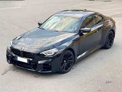 Black sapphire metallic Gebraucht 2023 BMW M2 Performance Coupé | 71.900 €