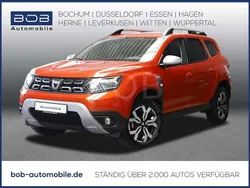 Arizonaorange metal (orange) Gebraucht 2022 Dacia Duster Prestige SUV | 21.970 € (Fairer Preis)